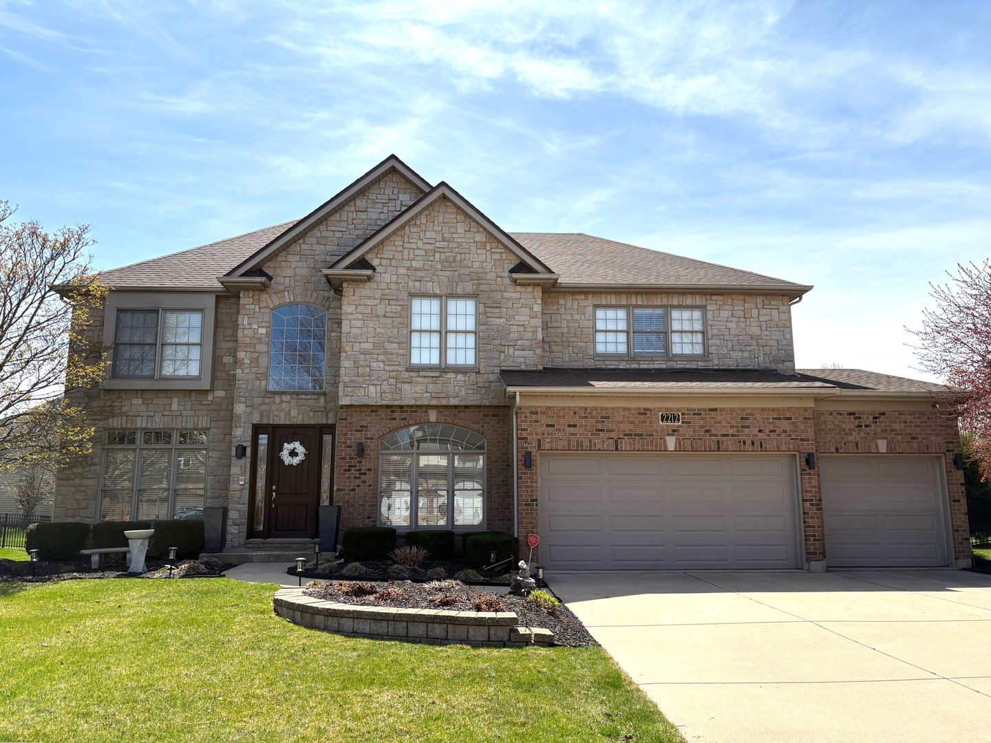 2212 Spartina Road Naperville, IL 60564 - Photo 2 of 17 a front view of a house with a yard