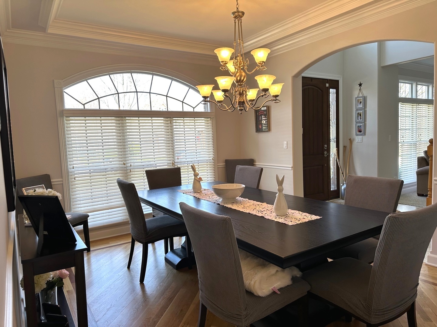 2212 Spartina Road Naperville, IL 60564 - Photo 7 of 17 a view of a dining room with furniture a chandelier and wooden floor