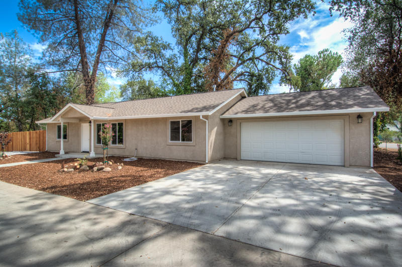 2765 Henderson Road Redding, CA 96002 - Photo 1 of 33 a view of a house with backyard and trees