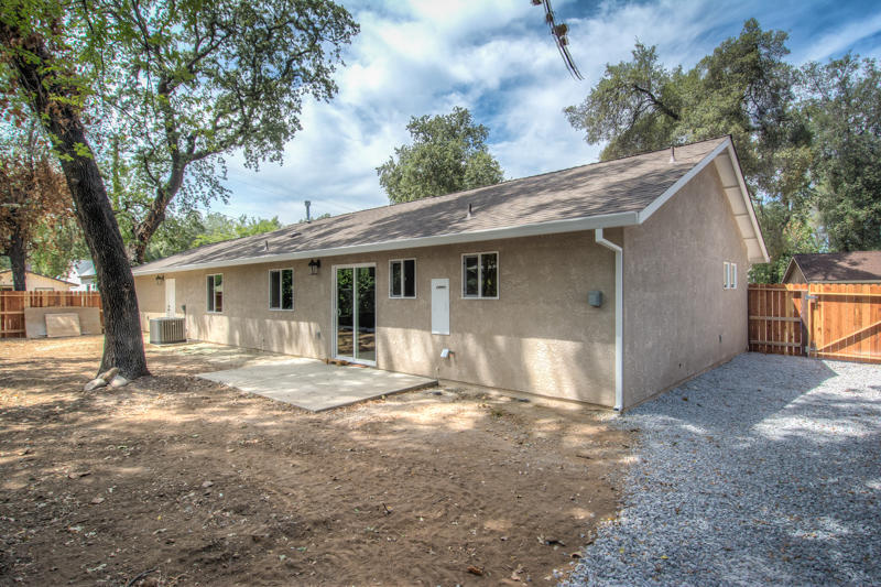 2765 Henderson Road Redding, CA 96002 - Photo 27 of 33 a view of a house with a yard and large tree