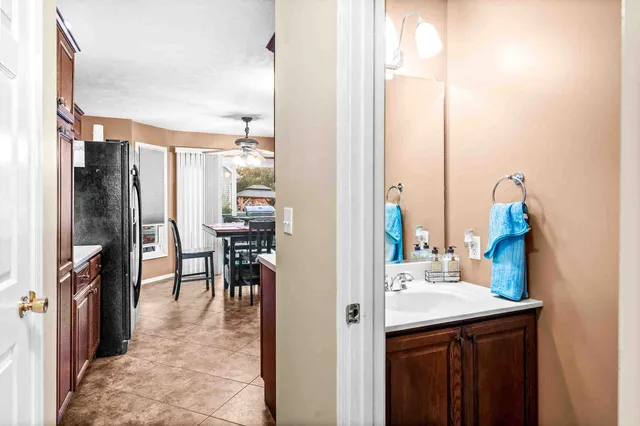 a kitchen with kitchen island a counter top space and stainless steel appliances