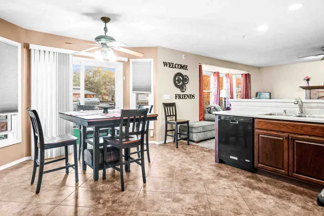 a kitchen with a table and chairs in it
