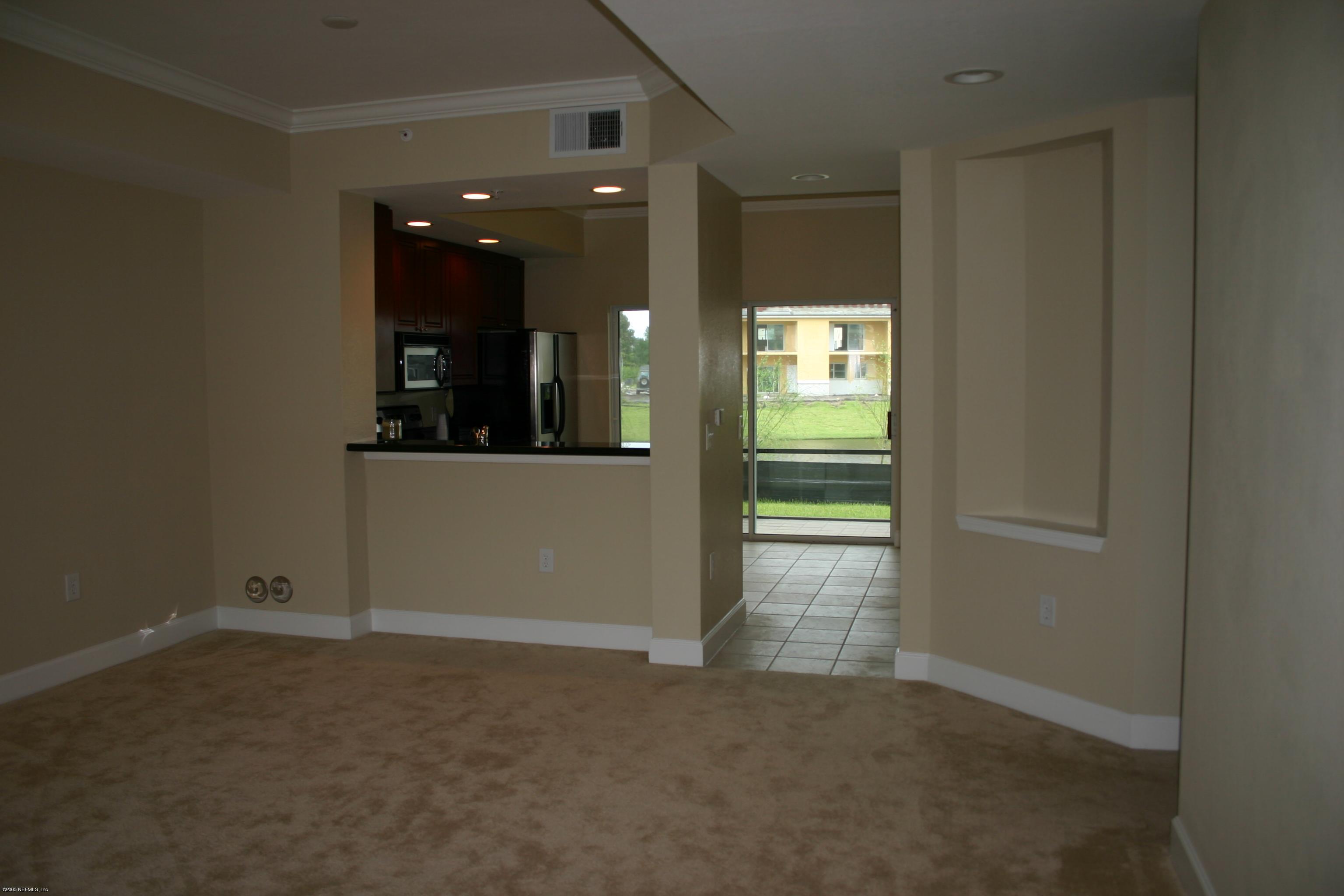 9745 Touchton Road, Unit 1802 Jacksonville, FL 32246 - Photo 3 of 4 Living Room to Kitchen
