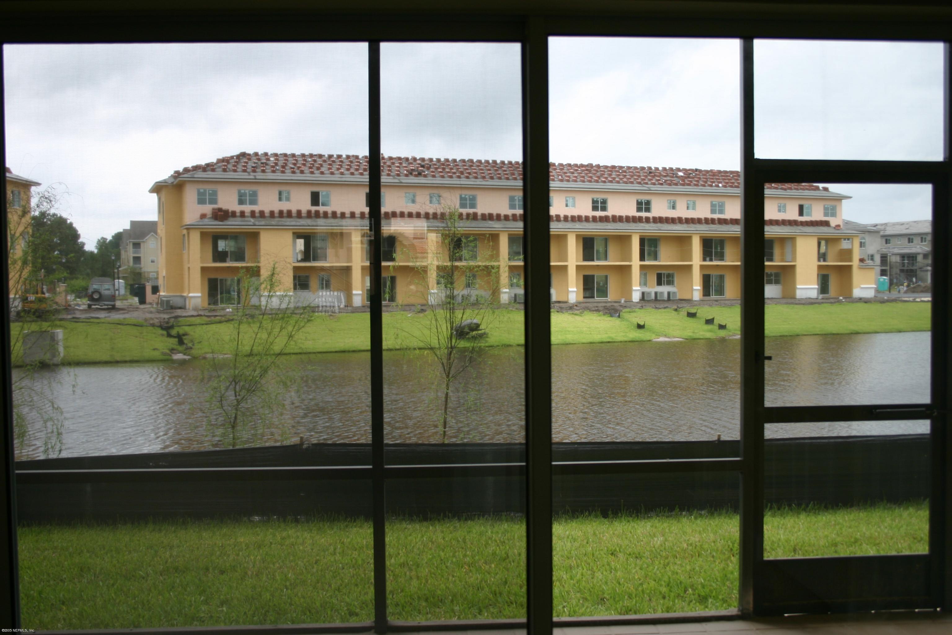 9745 Touchton Road, Unit 1802 Jacksonville, FL 32246 - Photo 4 of 4 View of Lake from Kitchen Sliding Doors