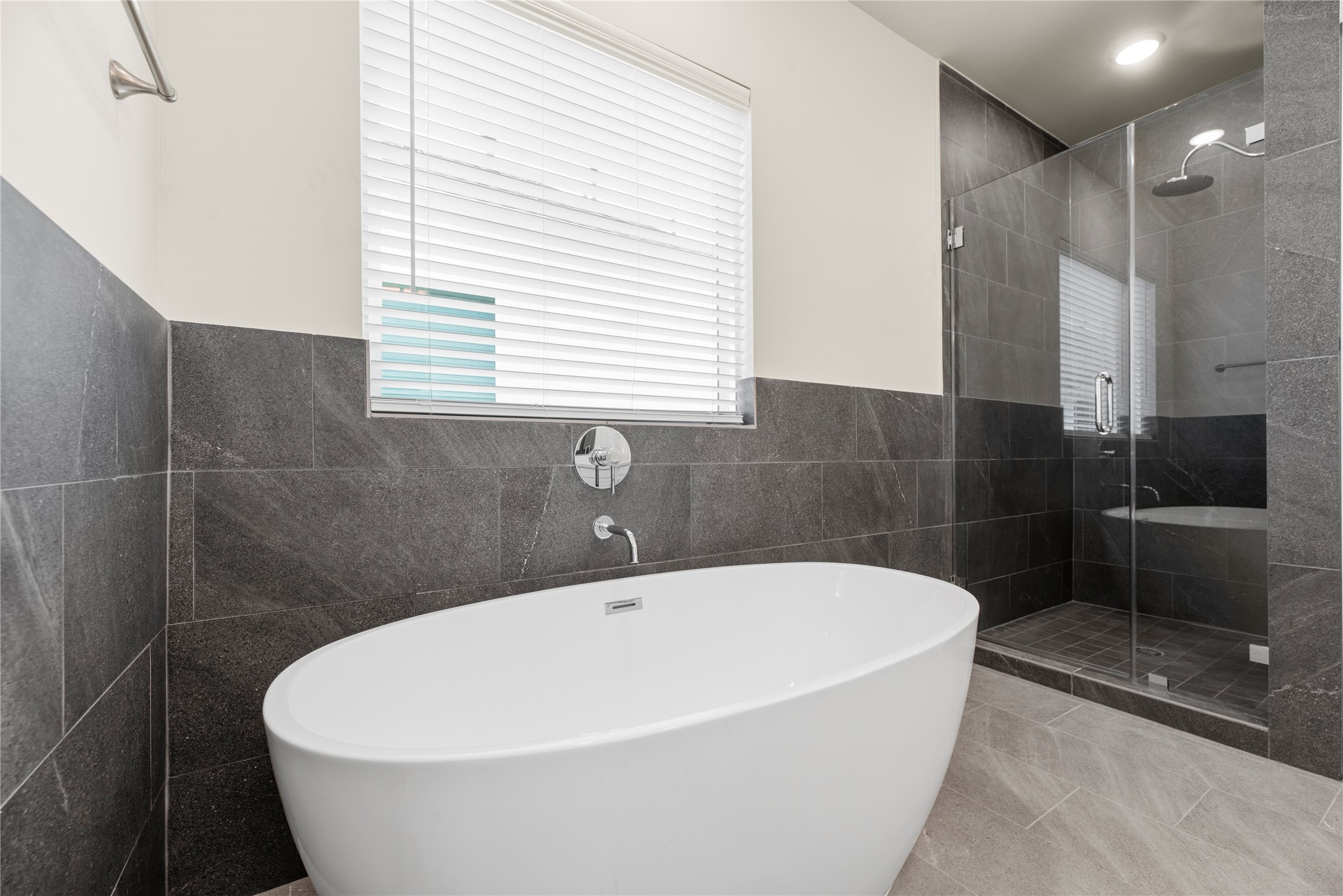 3075 Hicks Street Houston, TX 77007 - Photo 23 of 34 a white bath tub sitting in a bathroom