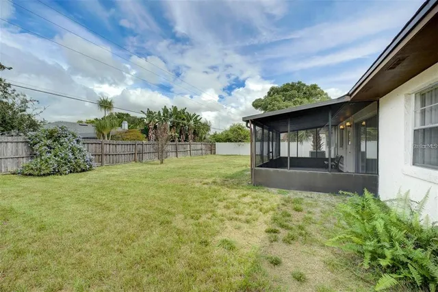 a view of a garden with a small cabin