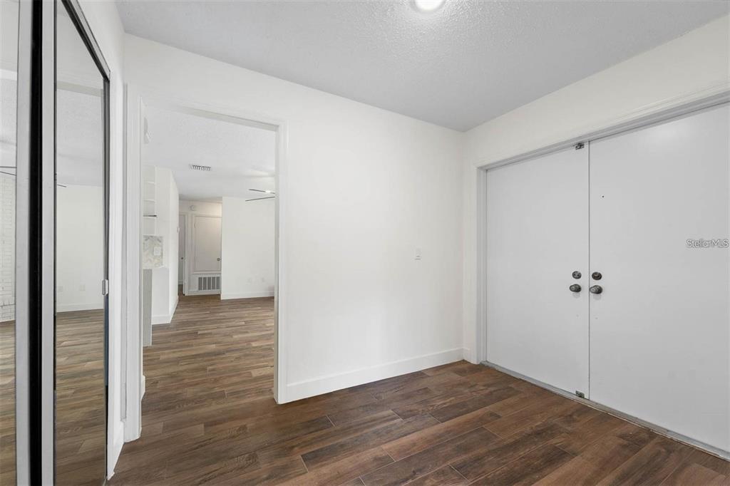 8323 Banyan Boulevard Orlando, FL 32819 - Photo 2 of 20 a view of a hallway with wooden floor