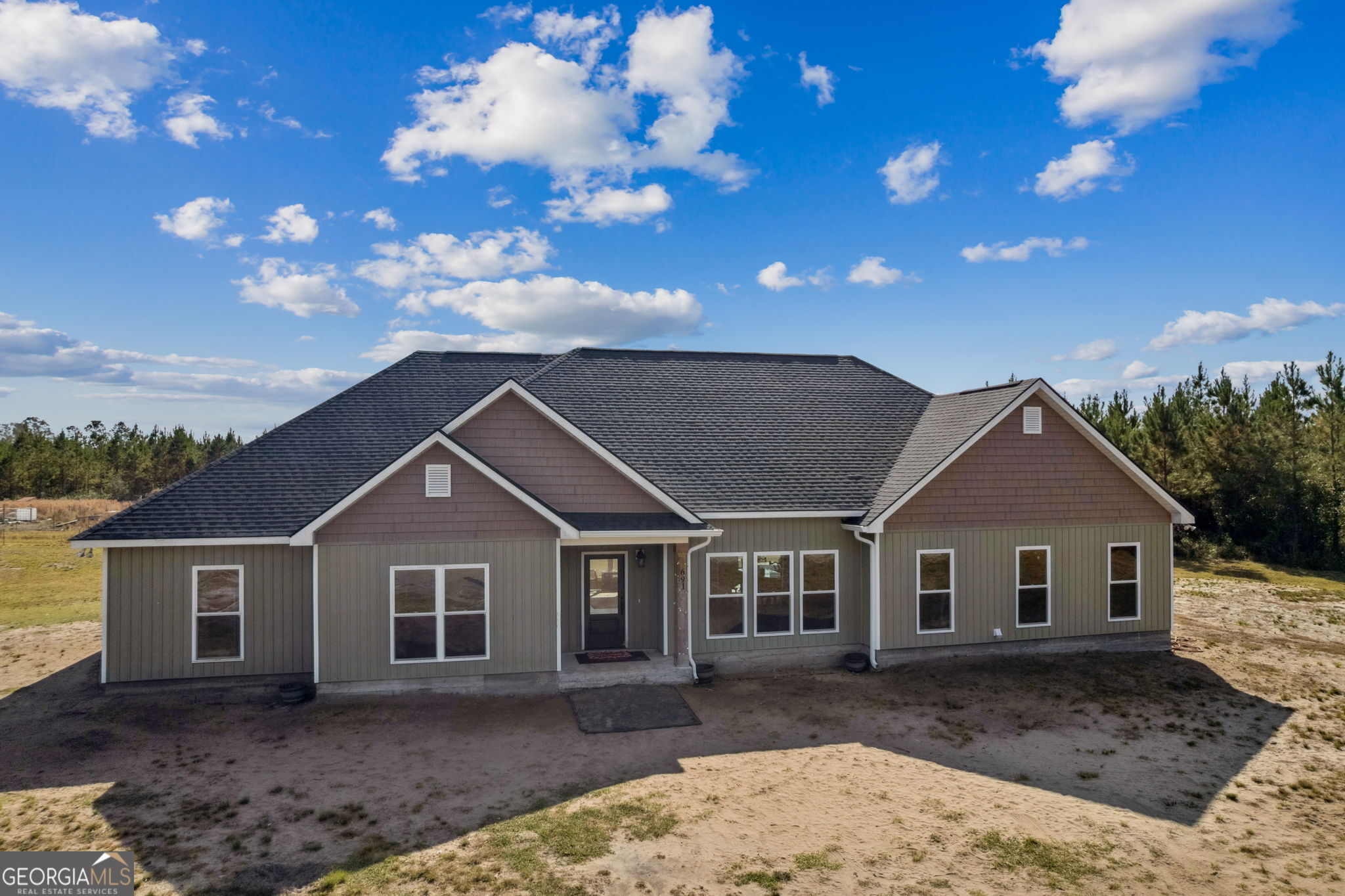 a front view of a house with a yard