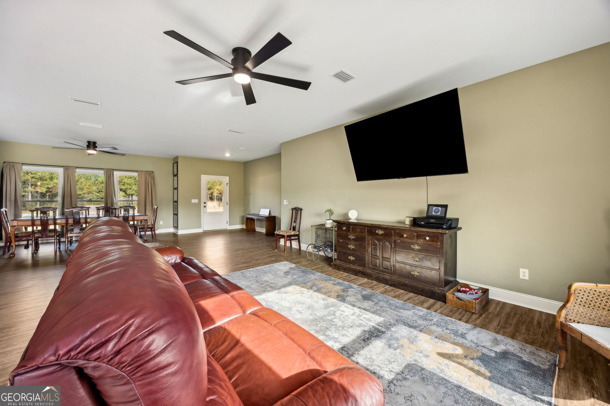 691 Oak Well Road Kingsland, GA 31548 - Photo 11 of 82 a living room with furniture and a flat screen tv