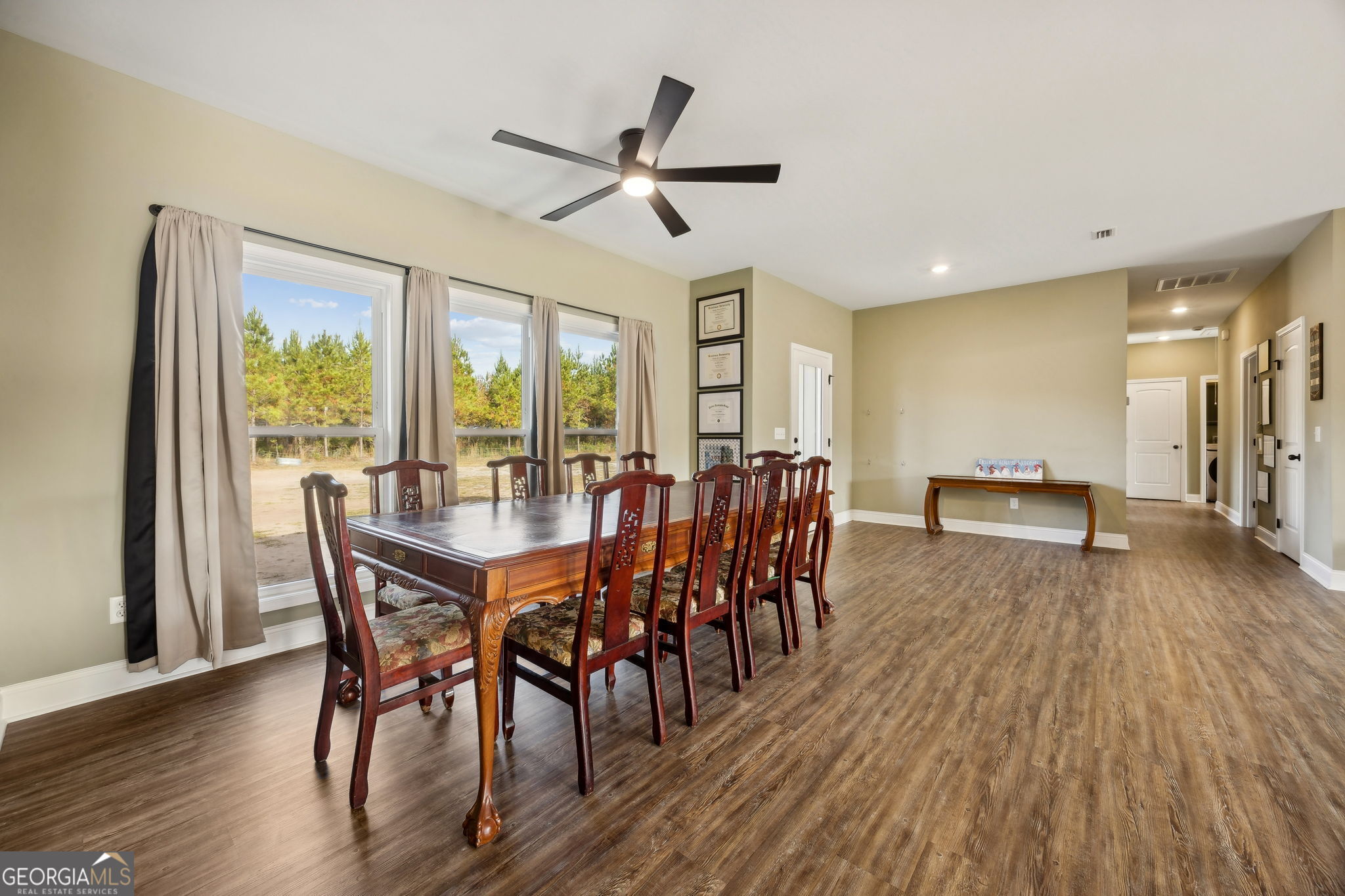 691 Oak Well Road Kingsland, GA 31548 - Photo 12 of 82 a view of a dining room with furniture window and wooden floor
