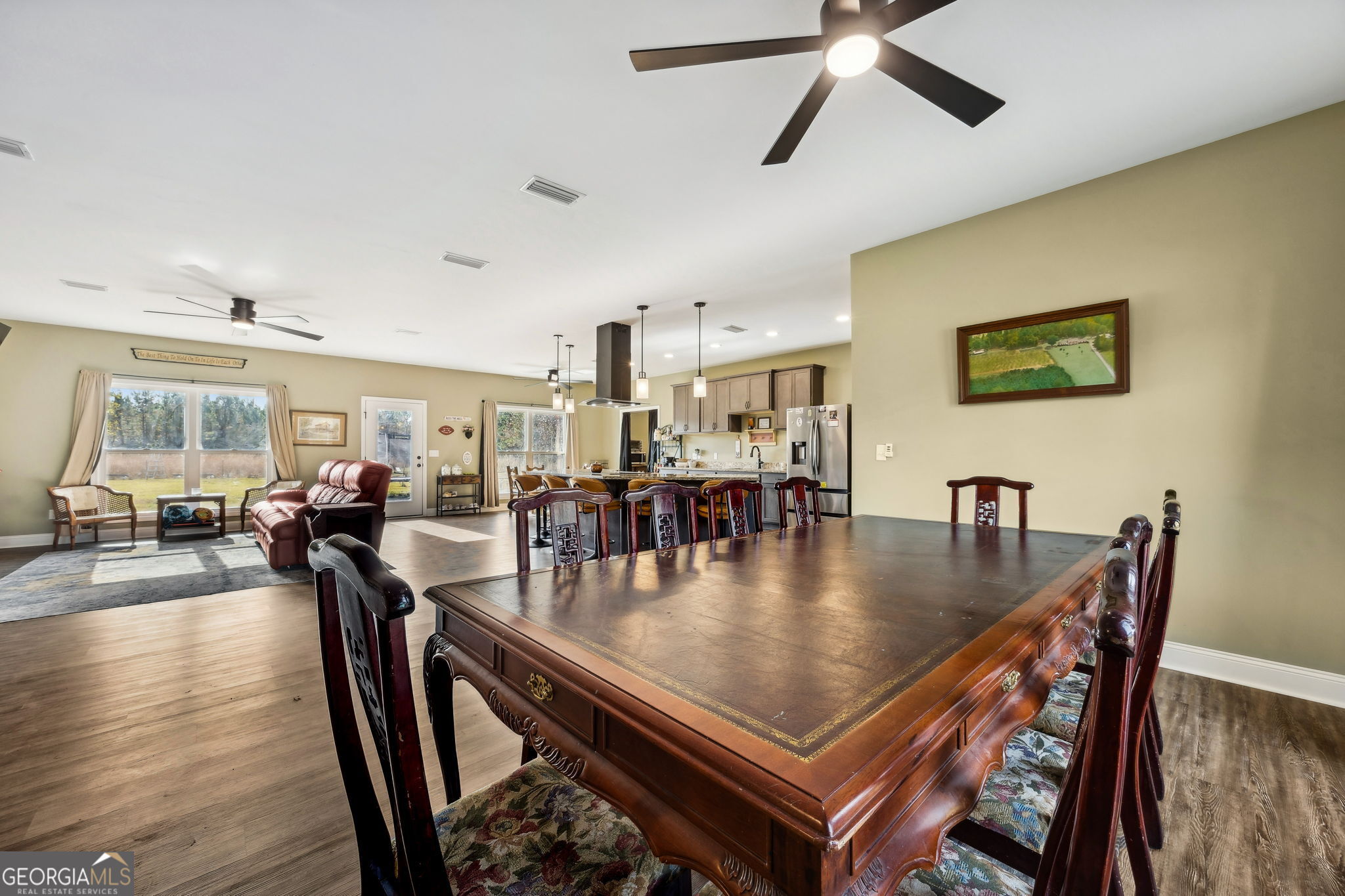691 Oak Well Road Kingsland, GA 31548 - Photo 14 of 82 a dining room with furniture and wooden floor