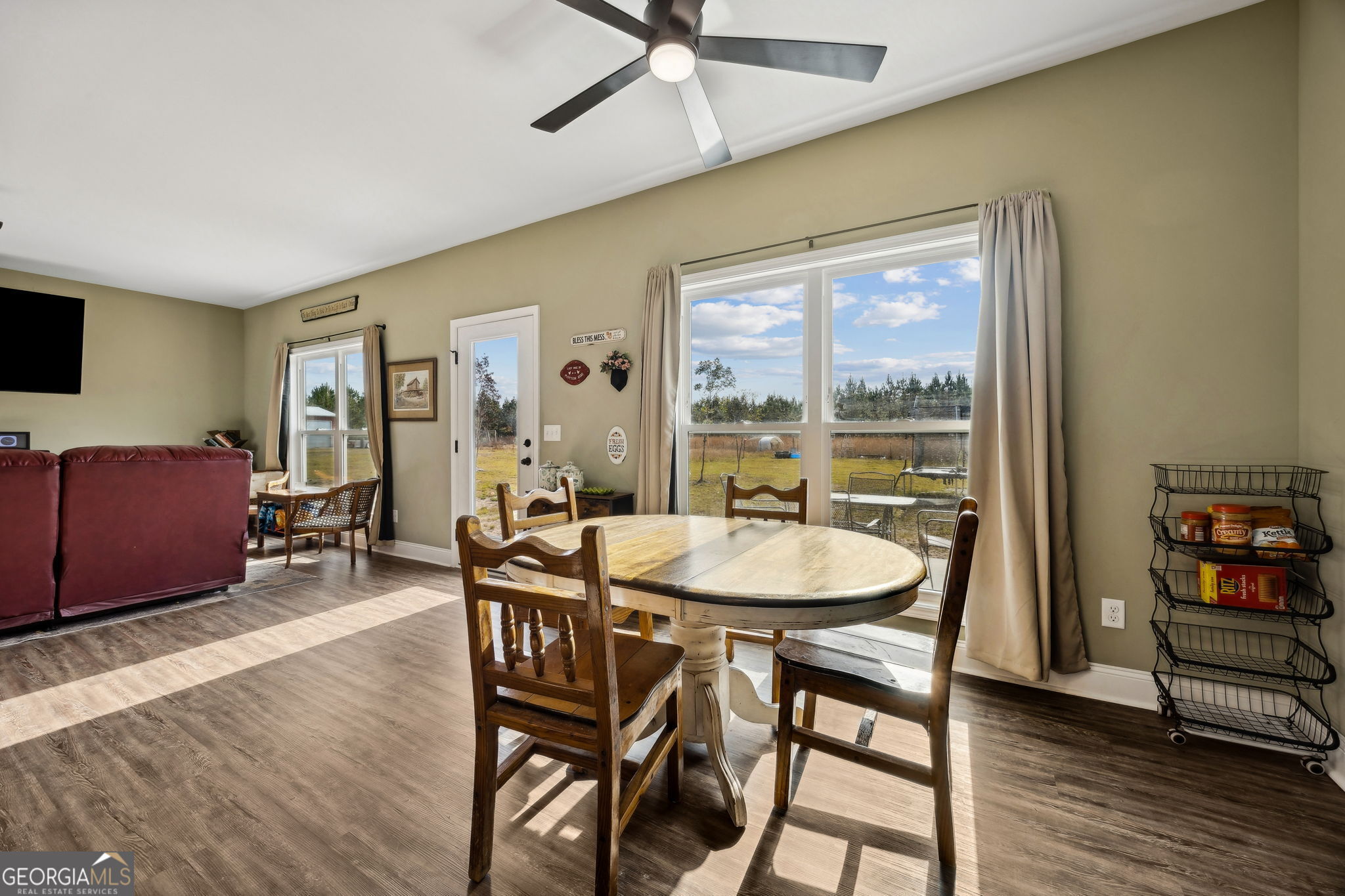 691 Oak Well Road Kingsland, GA 31548 - Photo 24 of 82 a view of a dining room with furniture window and wooden floor