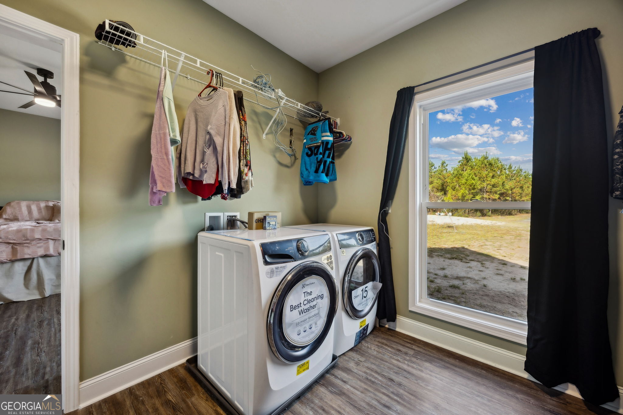 691 Oak Well Road Kingsland, GA 31548 - Photo 39 of 82 a view of walk in closet with clothes and shoes
