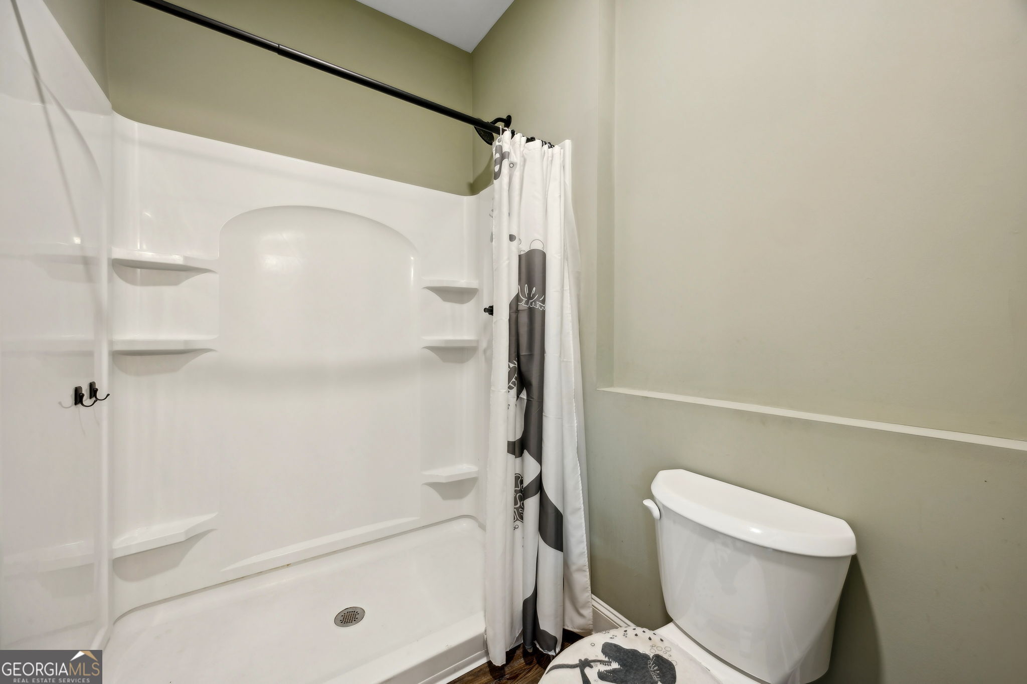 691 Oak Well Road Kingsland, GA 31548 - Photo 51 of 82 a bathroom with a shower and a toilet