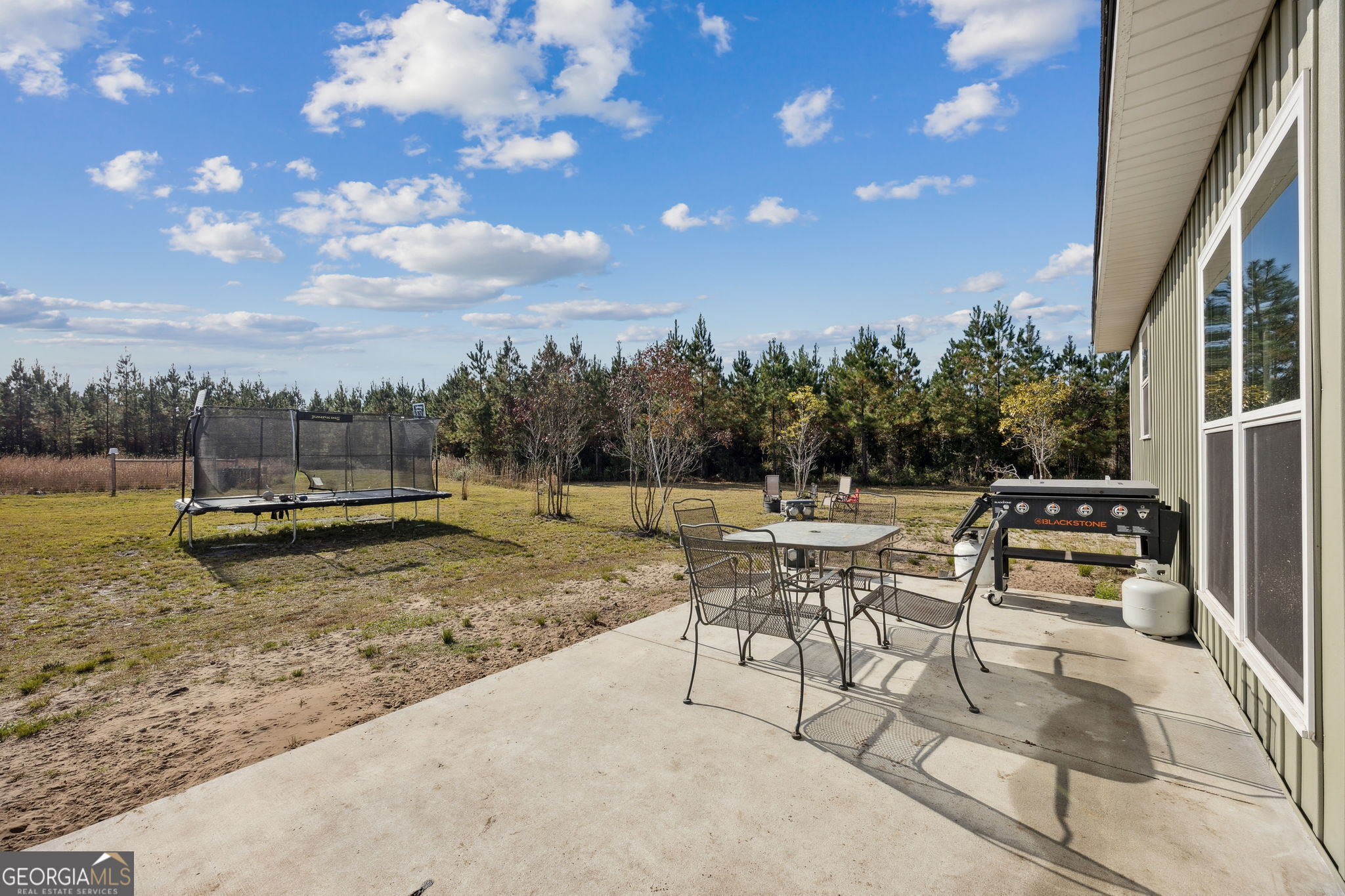 691 Oak Well Road Kingsland, GA 31548 - Photo 59 of 82 a view of a backyard with sitting area