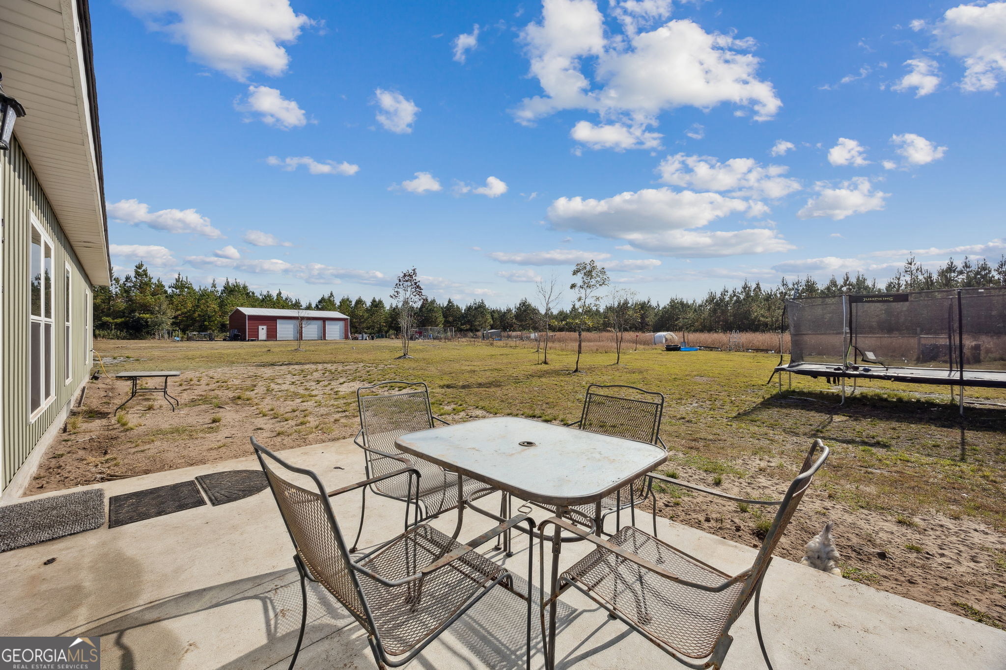 691 Oak Well Road Kingsland, GA 31548 - Photo 60 of 82 a view of a swimming pool with outdoor seating