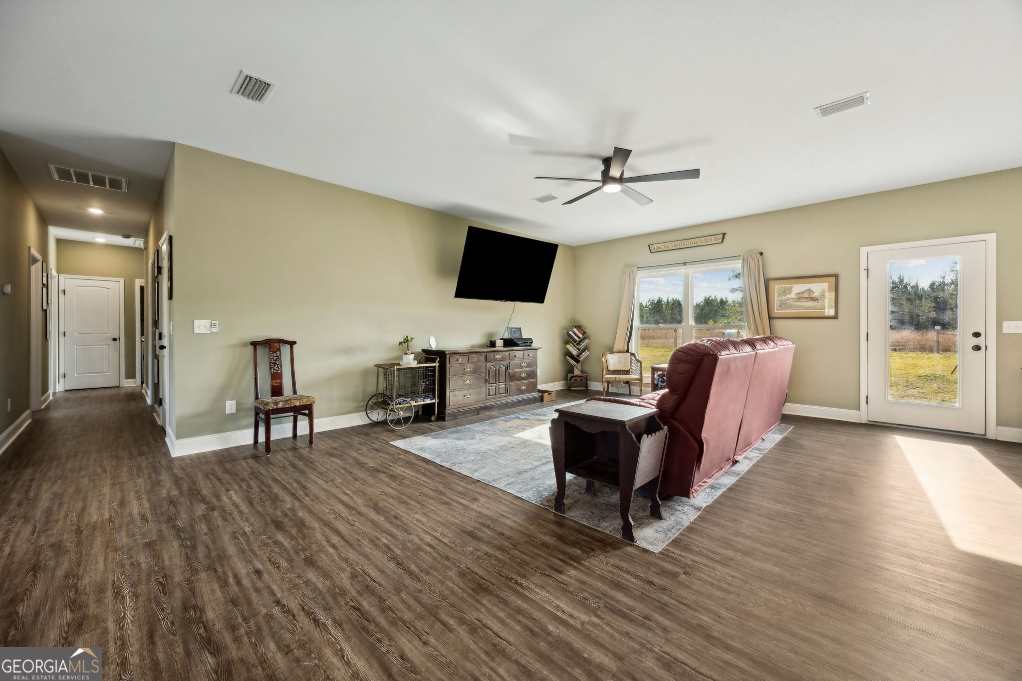 691 Oak Well Road Kingsland, GA 31548 - Photo 7 of 82 a living room with furniture and a flat screen tv