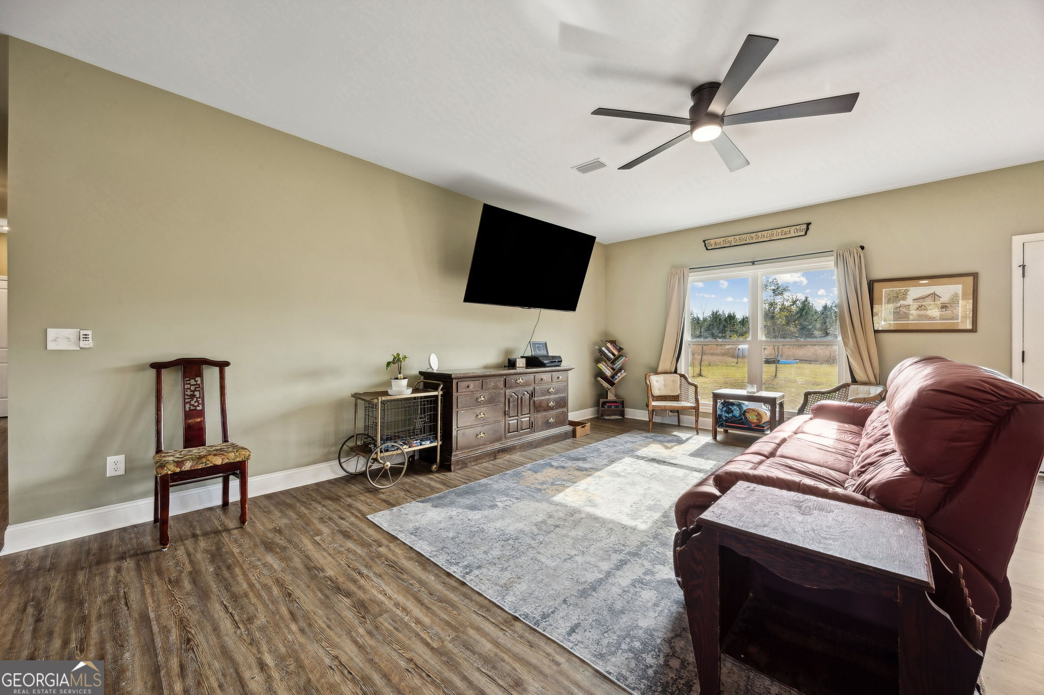 691 Oak Well Road Kingsland, GA 31548 - Photo 8 of 82 a living room with furniture and a flat screen tv
