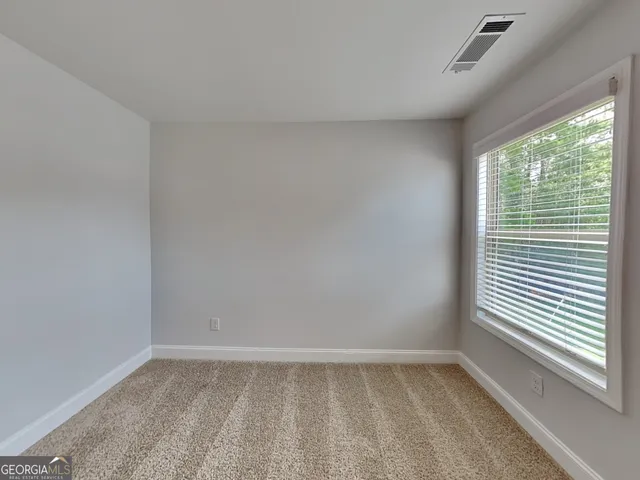 a bathroom with a double vanity sink toilet and shower