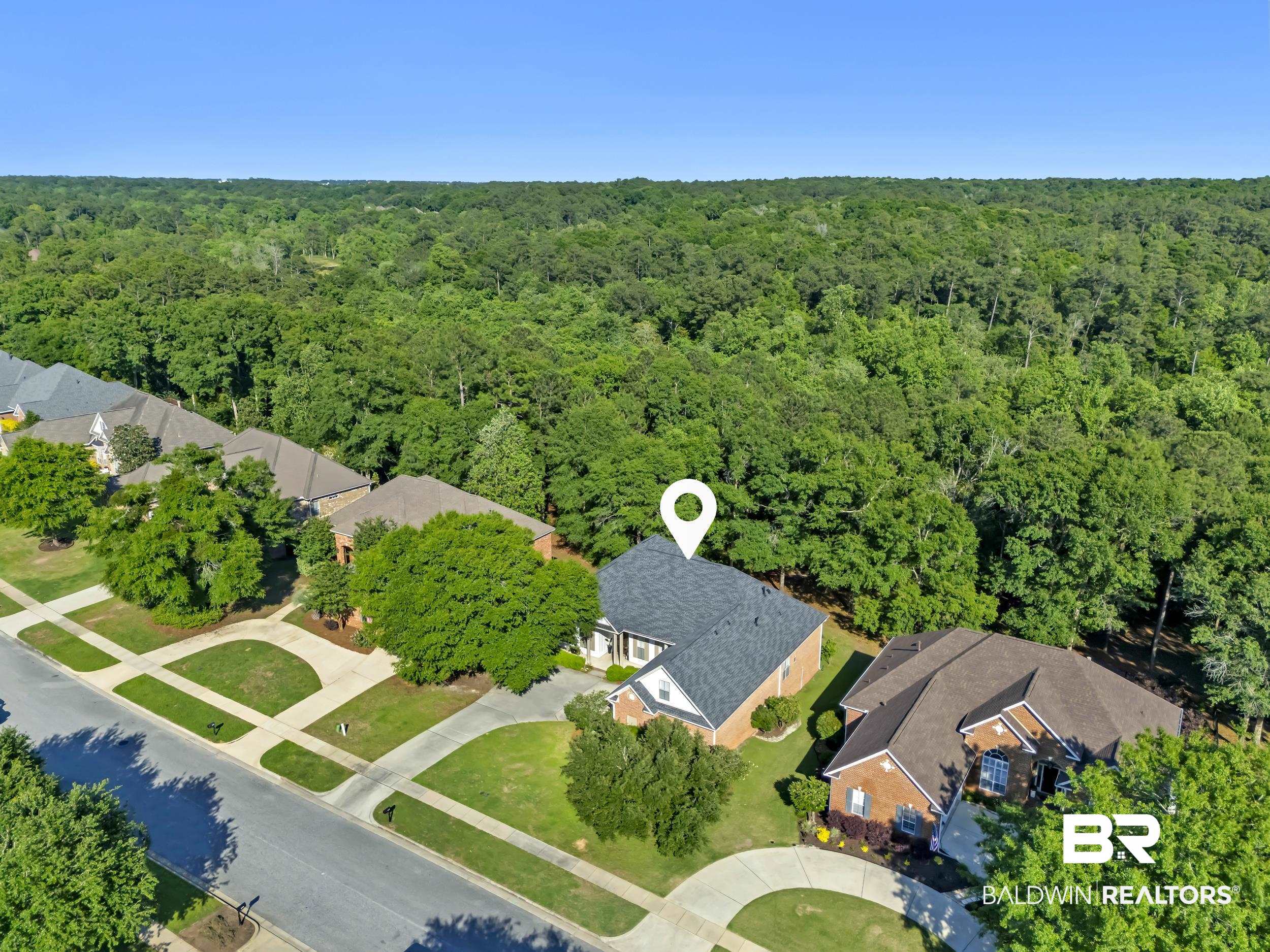 8137 Pine Run Daphne, AL 36527 - Photo 50 of 67 Aerial perspective showcasing a residential property with a dark shingle roof and light brick exterior