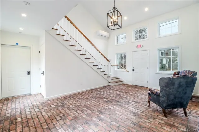 a view of an empty room and wooden floor