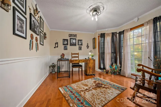 a view of a livingroom with furniture and window