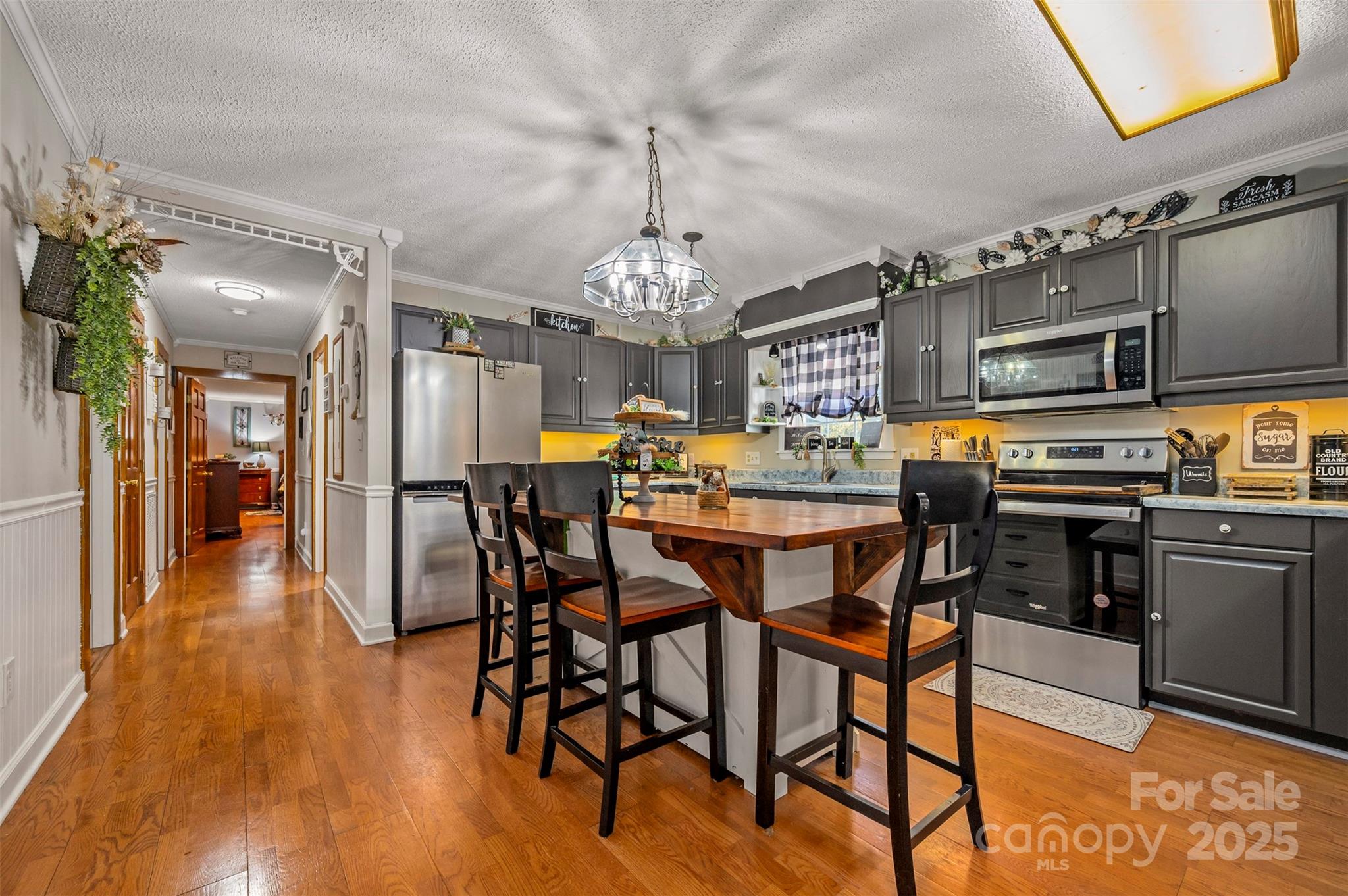 334 Bridge Road Ellenboro, NC 28040 - Photo 18 of 48 a view of a dining room with furniture and chandelier