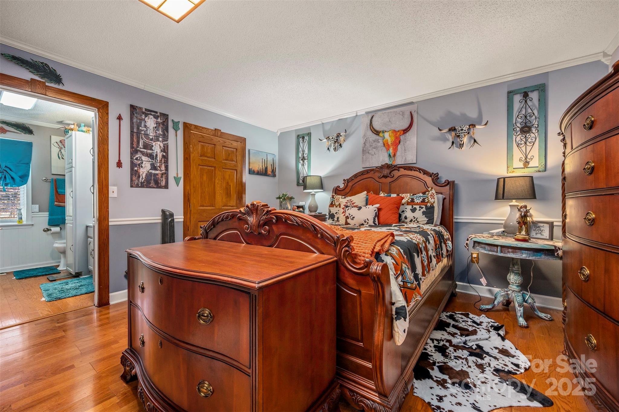 334 Bridge Road Ellenboro, NC 28040 - Photo 23 of 48 a bedroom with bed and wooden floor