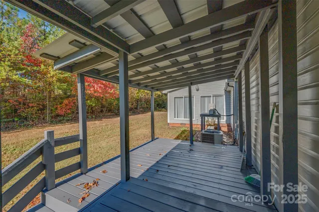 a view of outdoor space with wooden floor and outdoor seating