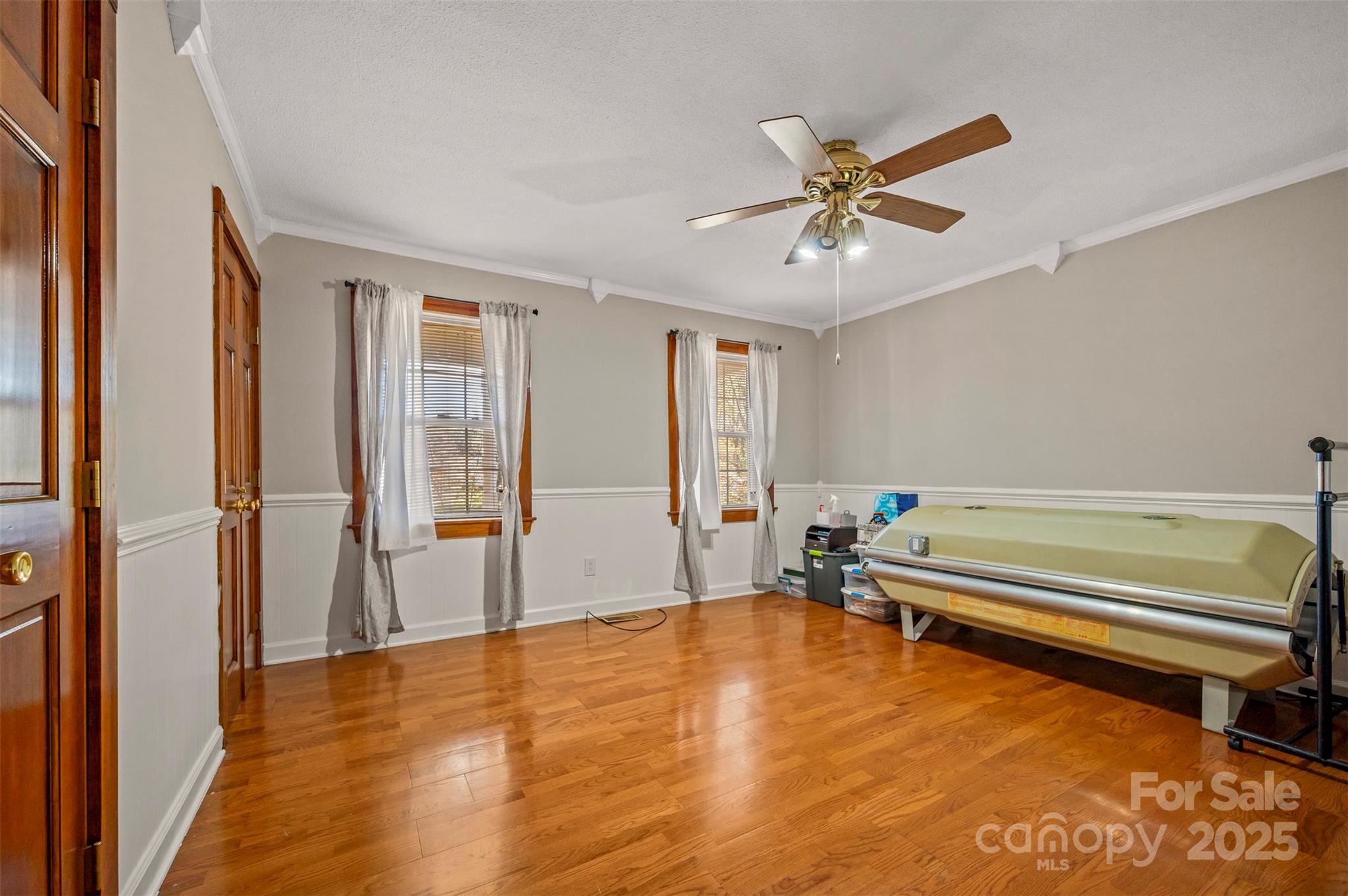 334 Bridge Road Ellenboro, NC 28040 - Photo 28 of 48 a view of an empty room with window and a ceiling fan