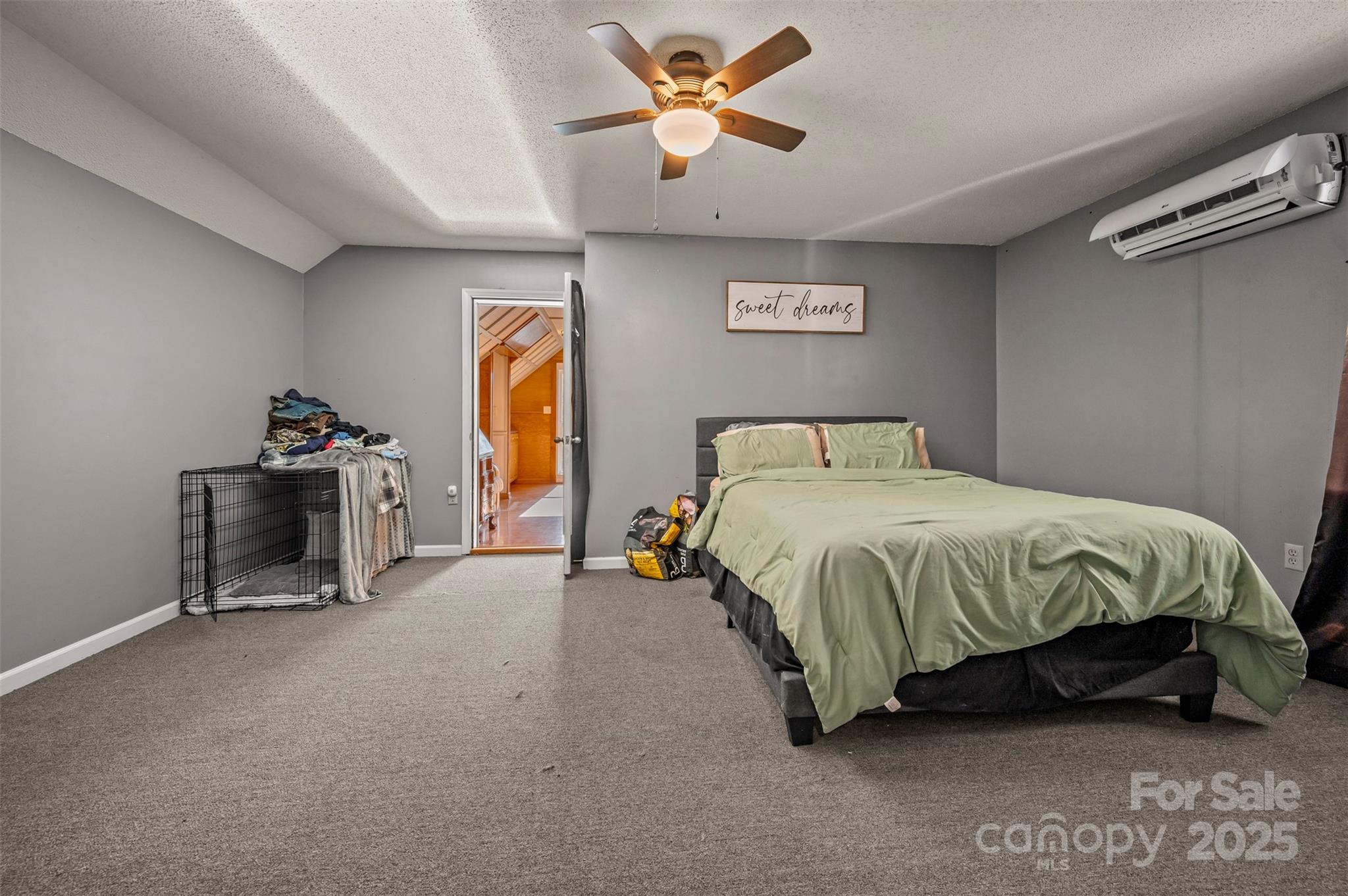 334 Bridge Road Ellenboro, NC 28040 - Photo 29 of 48 a spacious bedroom with a bed and a chandelier