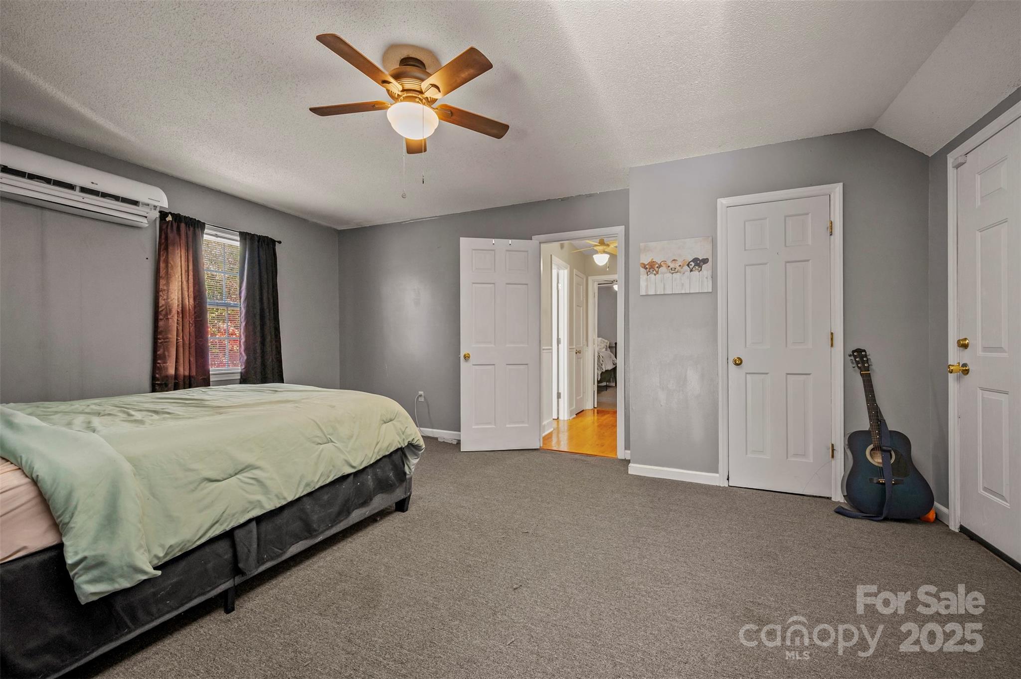 334 Bridge Road Ellenboro, NC 28040 - Photo 30 of 48 a bed room with a bed and a chandelier