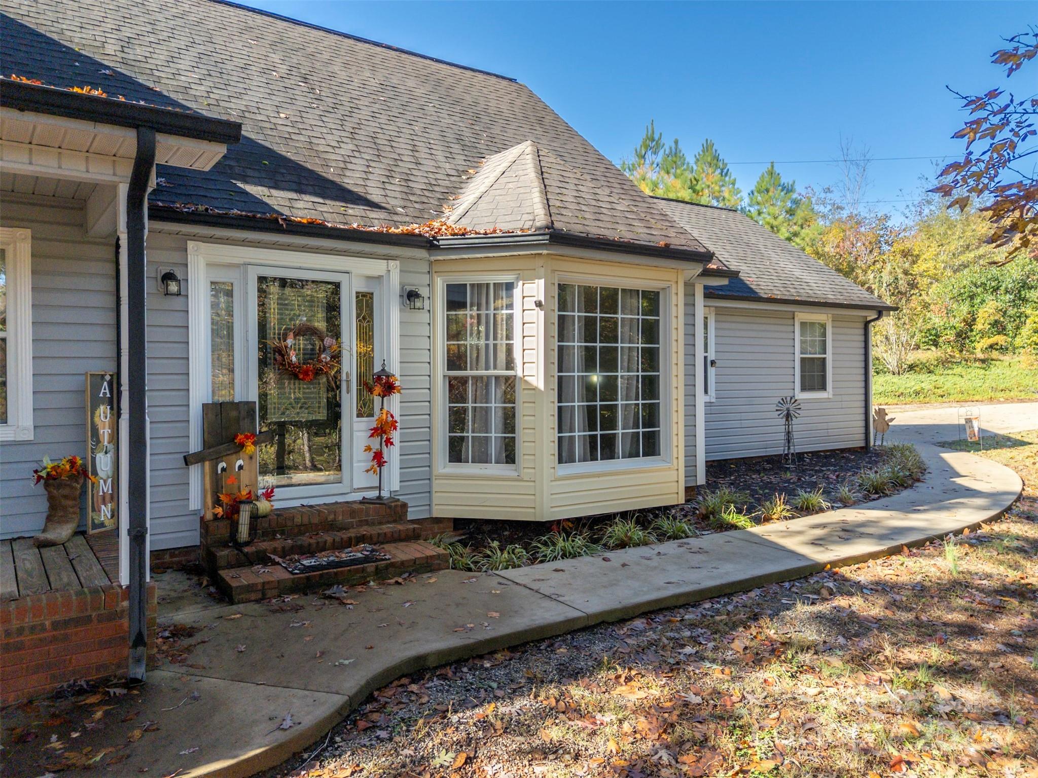 334 Bridge Road Ellenboro, NC 28040 - Photo 5 of 48 a front view of a house with a yard
