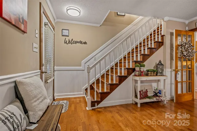 a view of an entryway with wooden floor