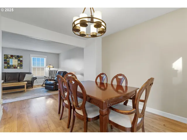 a view of a dining room and hall with furniture