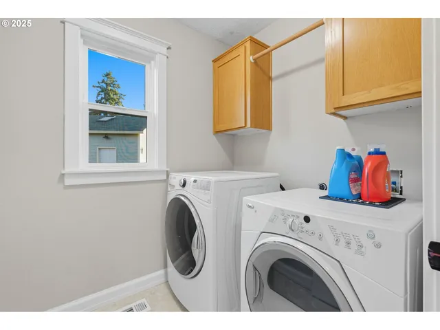 a utility room with dryer and washer