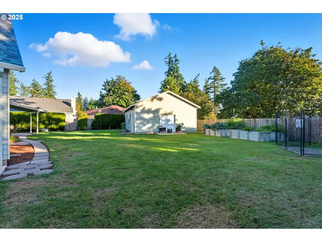 a view of yard with swimming pool and green space