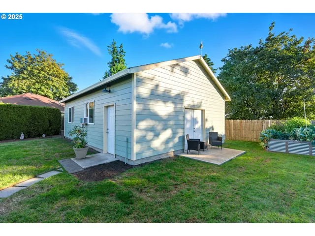 a house view with a sitting space and garden