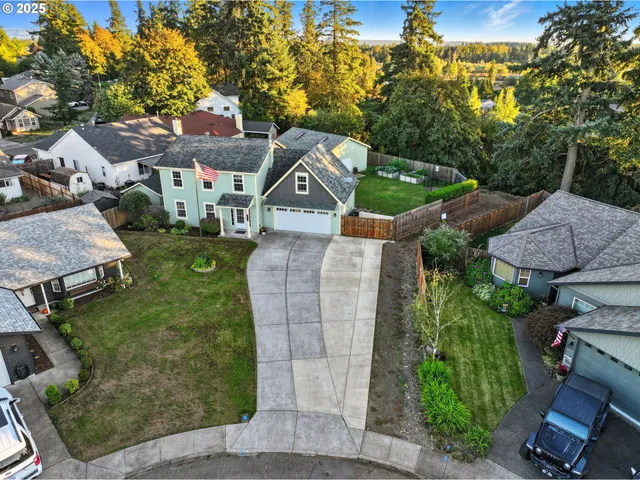 an aerial view of a house with a garden
