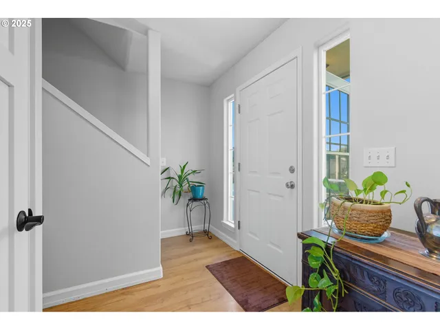 a view of an entryway and kitchen