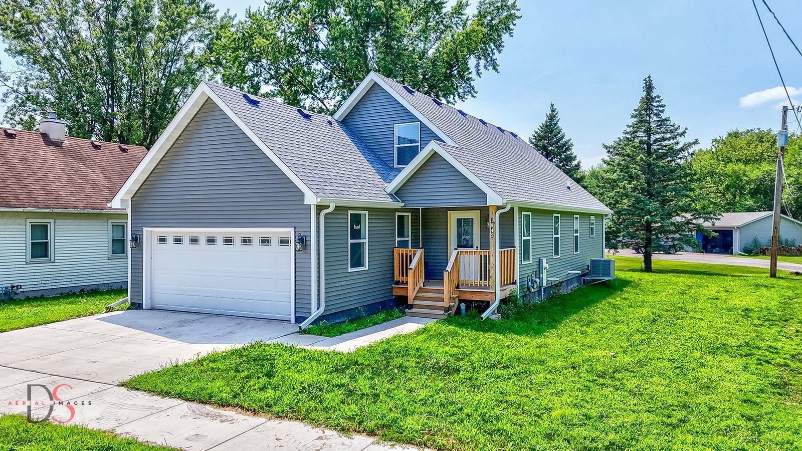 a front view of a house with a garden and porch