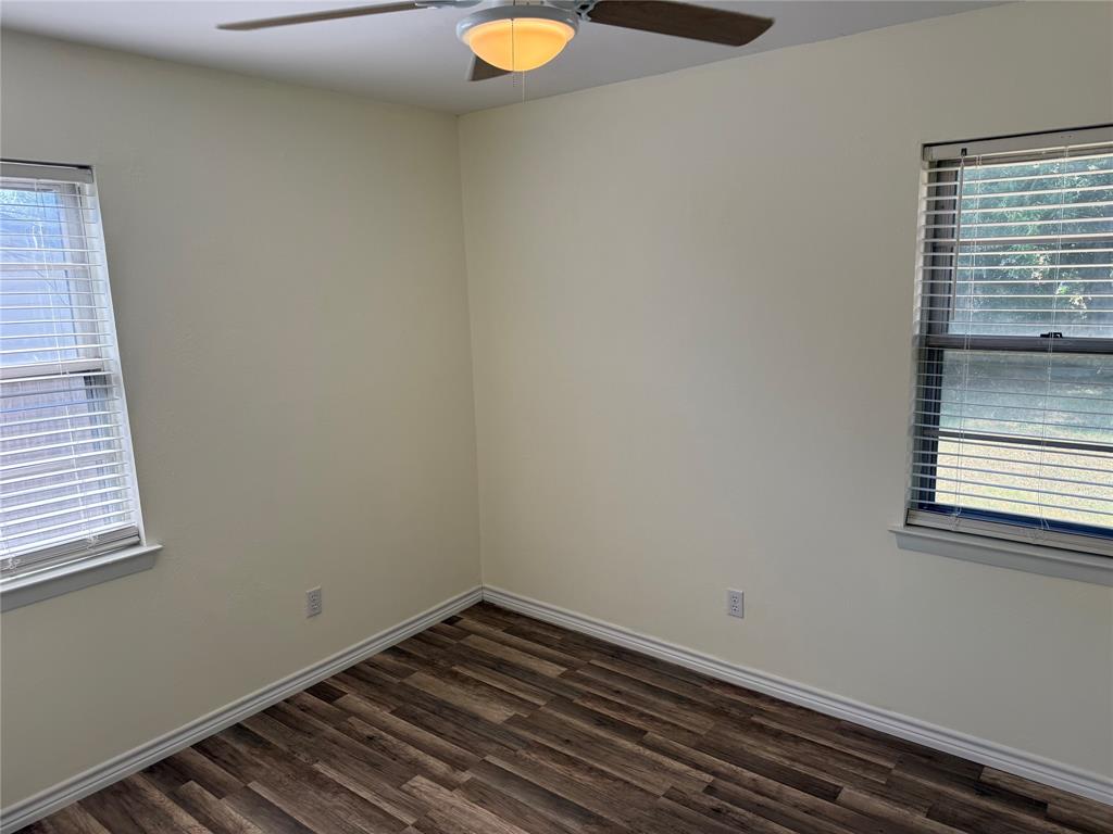 609 Crane Drive Euless, TX 76039 - Photo 15 of 15 a view of a room with wooden floor and fan