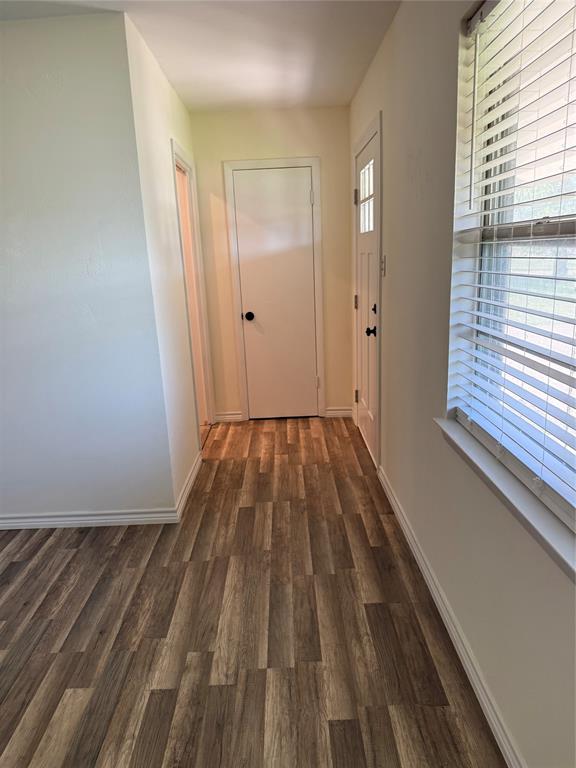 609 Crane Drive Euless, TX 76039 - Photo 5 of 15 a view of a room with wooden floor and window