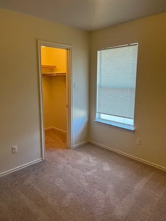 an empty room that has a window