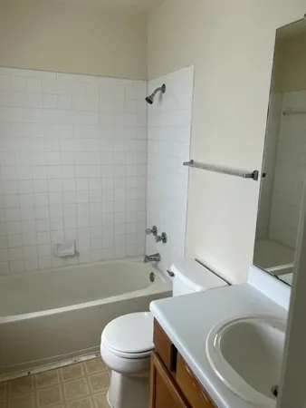 a bathroom with a sink and mirror