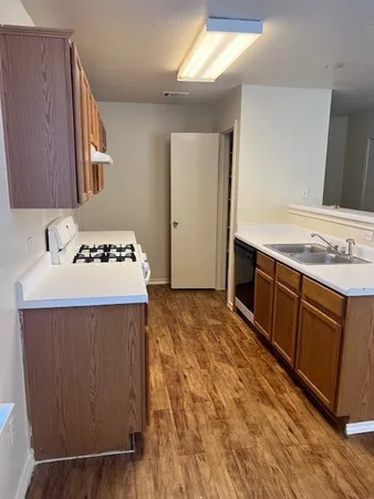 a kitchen with a stove and a sink