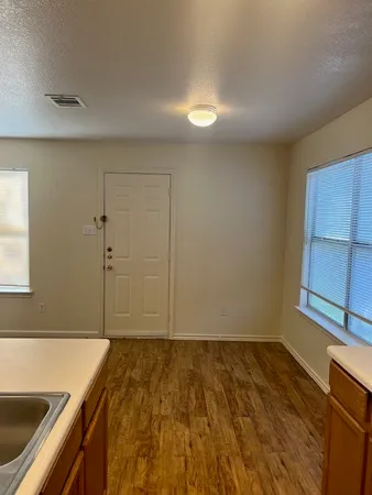 a bathroom with a tub and shower