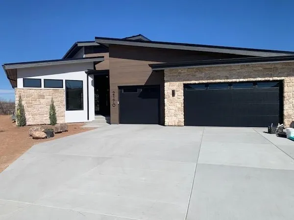 a front view of a house with yard