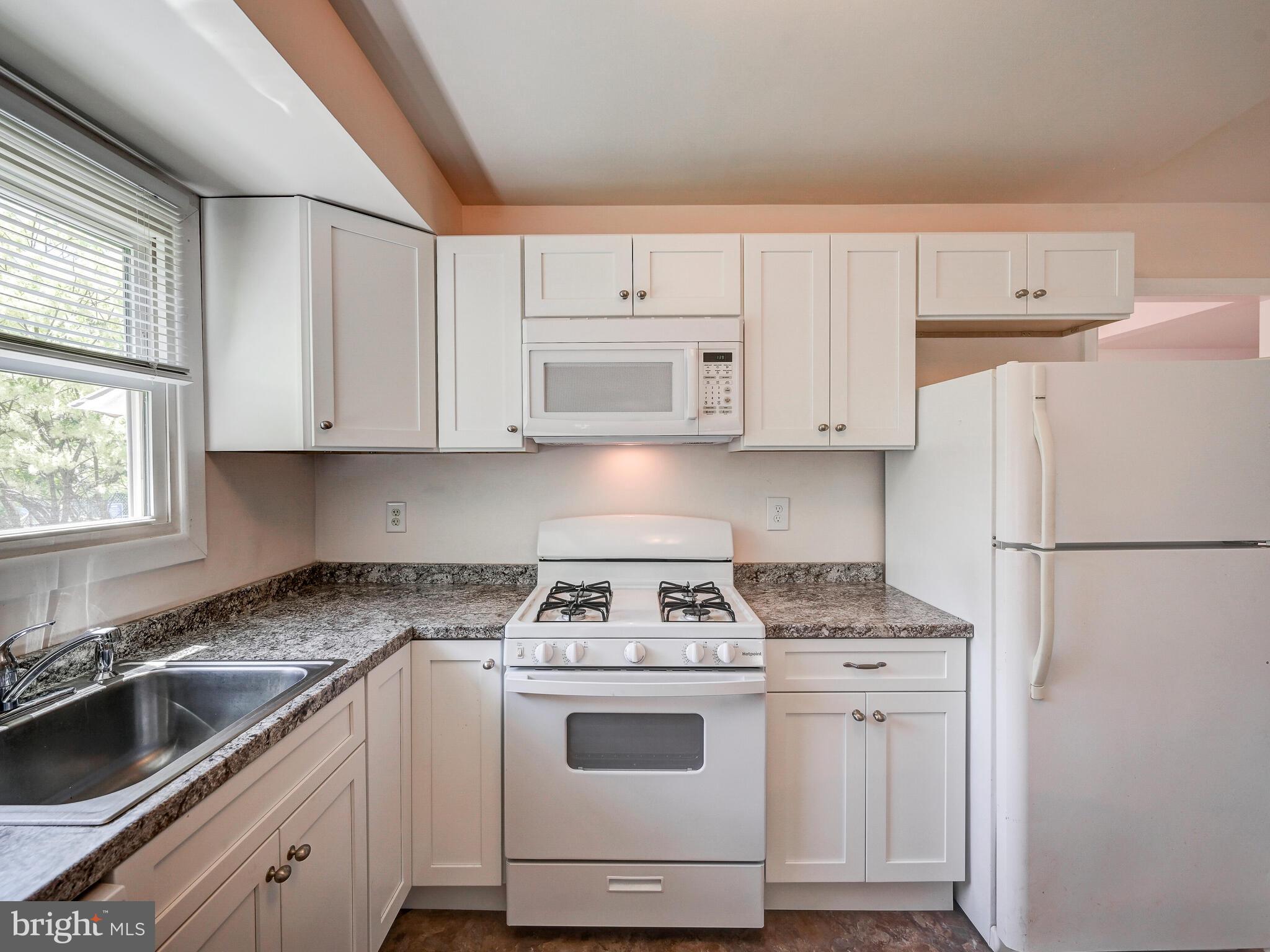 215 Highmeadow Road Reisterstown, MD 21136 - Photo 14 of 31 White Kitchen w/gas stove