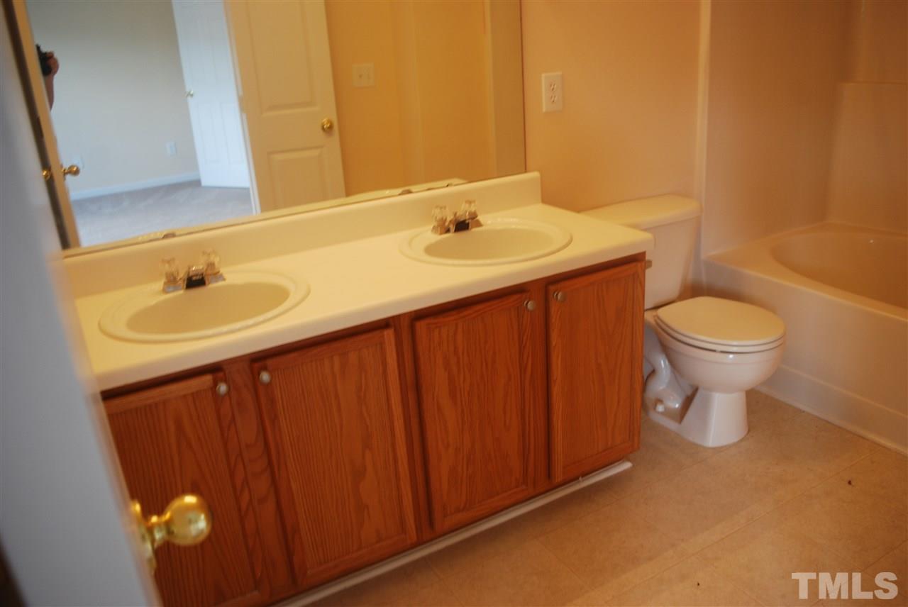 5326 Glen Canyon Road Raleigh, NC 27616 - Photo 4 of 6 a bathroom with a sink and a toilet